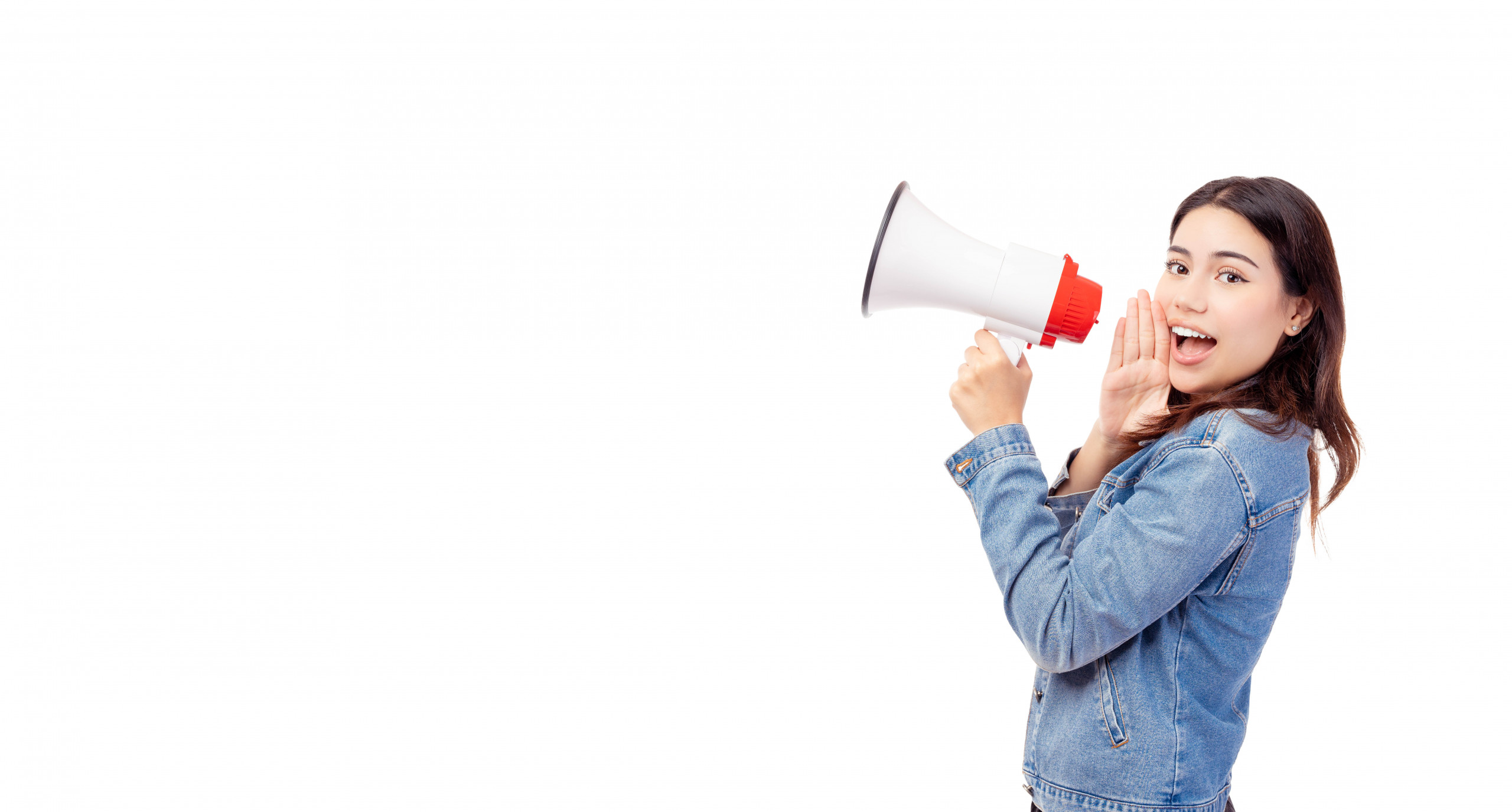 Smiling girl talking in megaphone